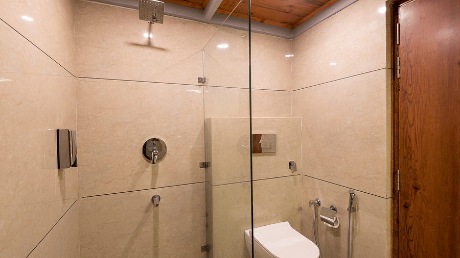 Bathroom of Spring Duplex at DLS Spring  Valley resort Dharamshala featuring a shower area and a toilet
